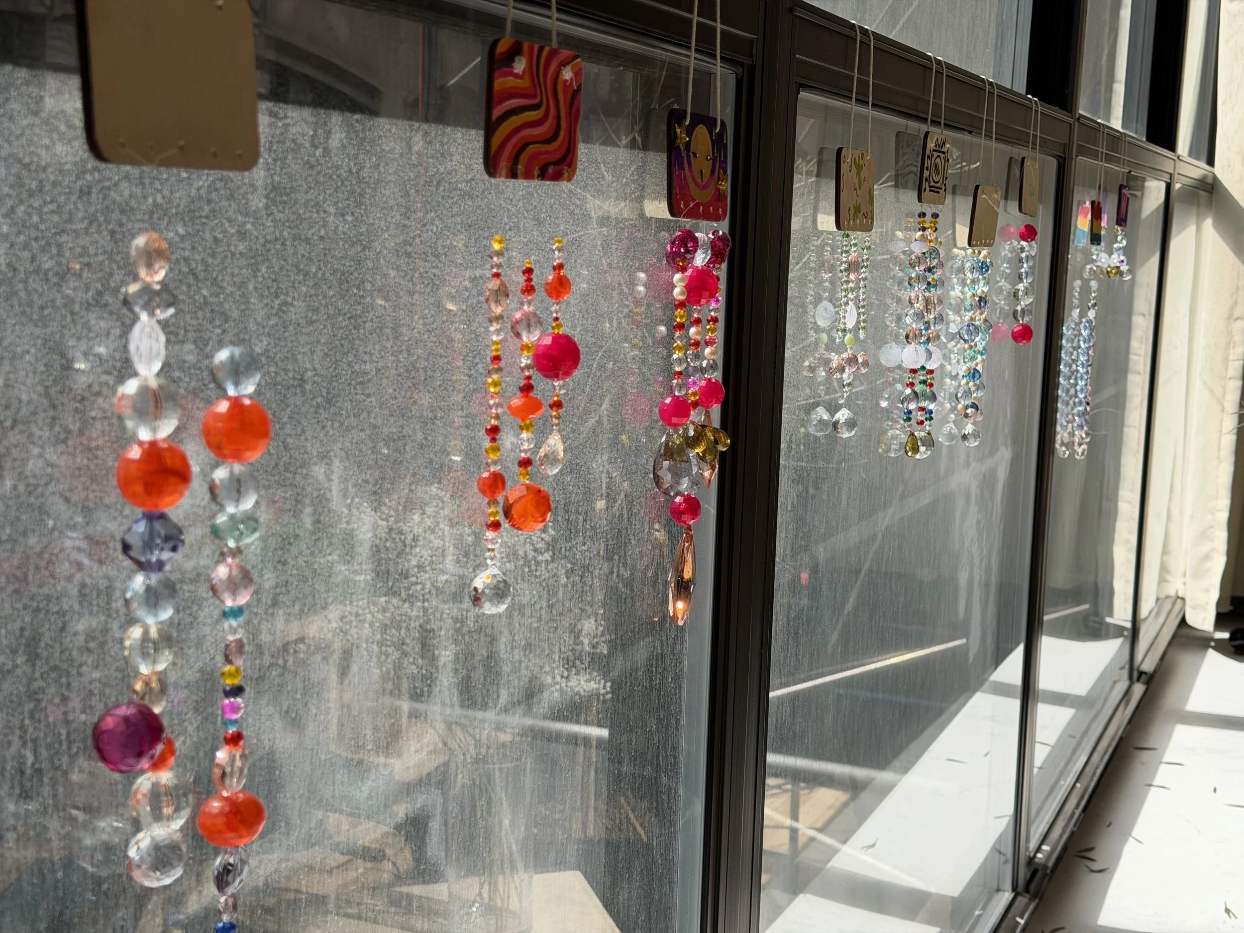  Image of beaded sun catchers in the window.  
