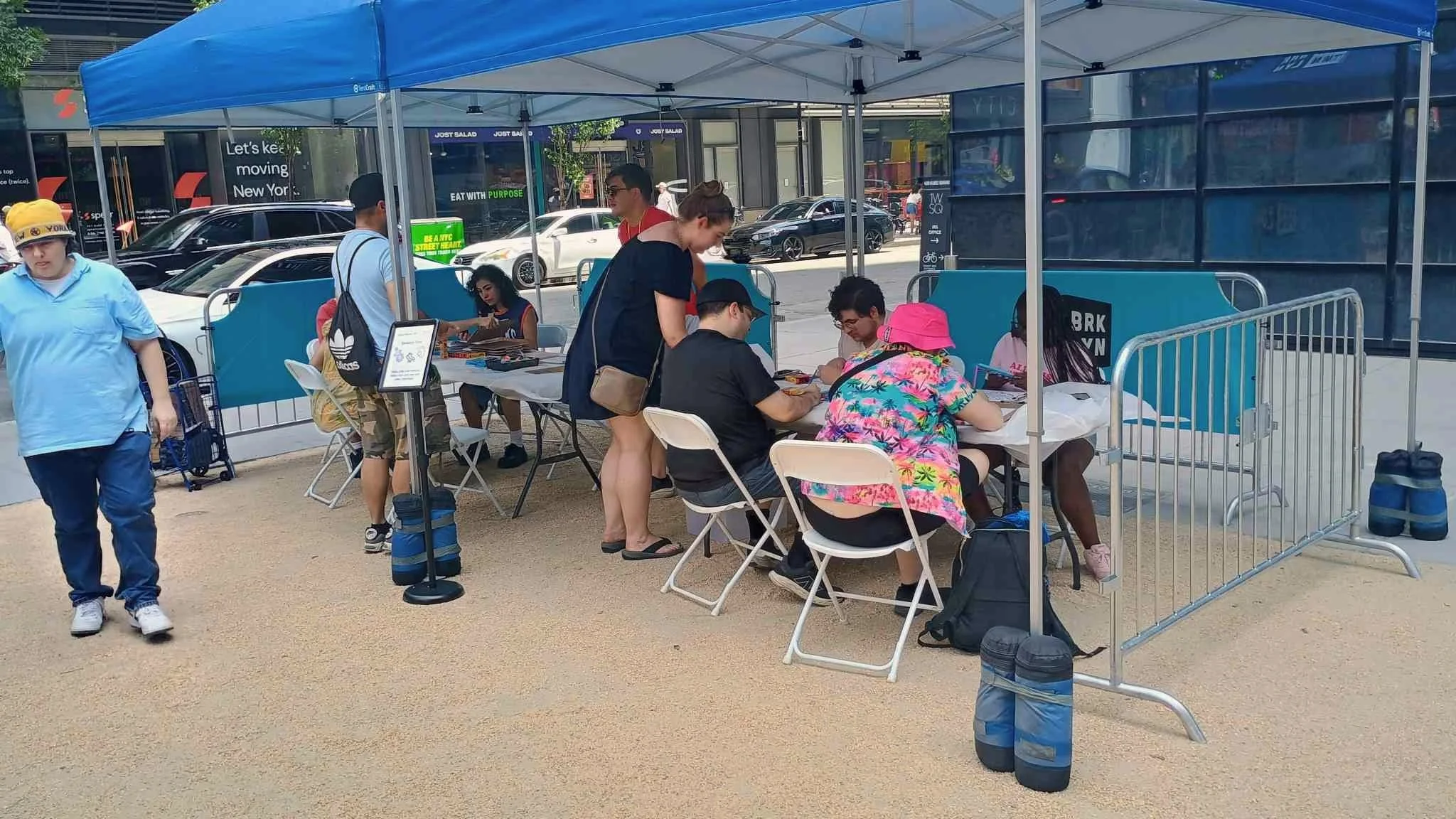 Attendees sitting around a table coloring 