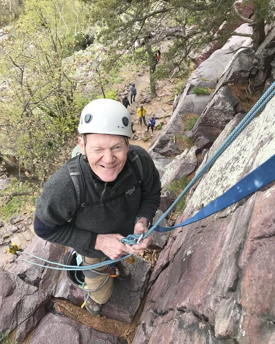  Ed prepares for his tallest rappel of the day, rigged by his own team. 