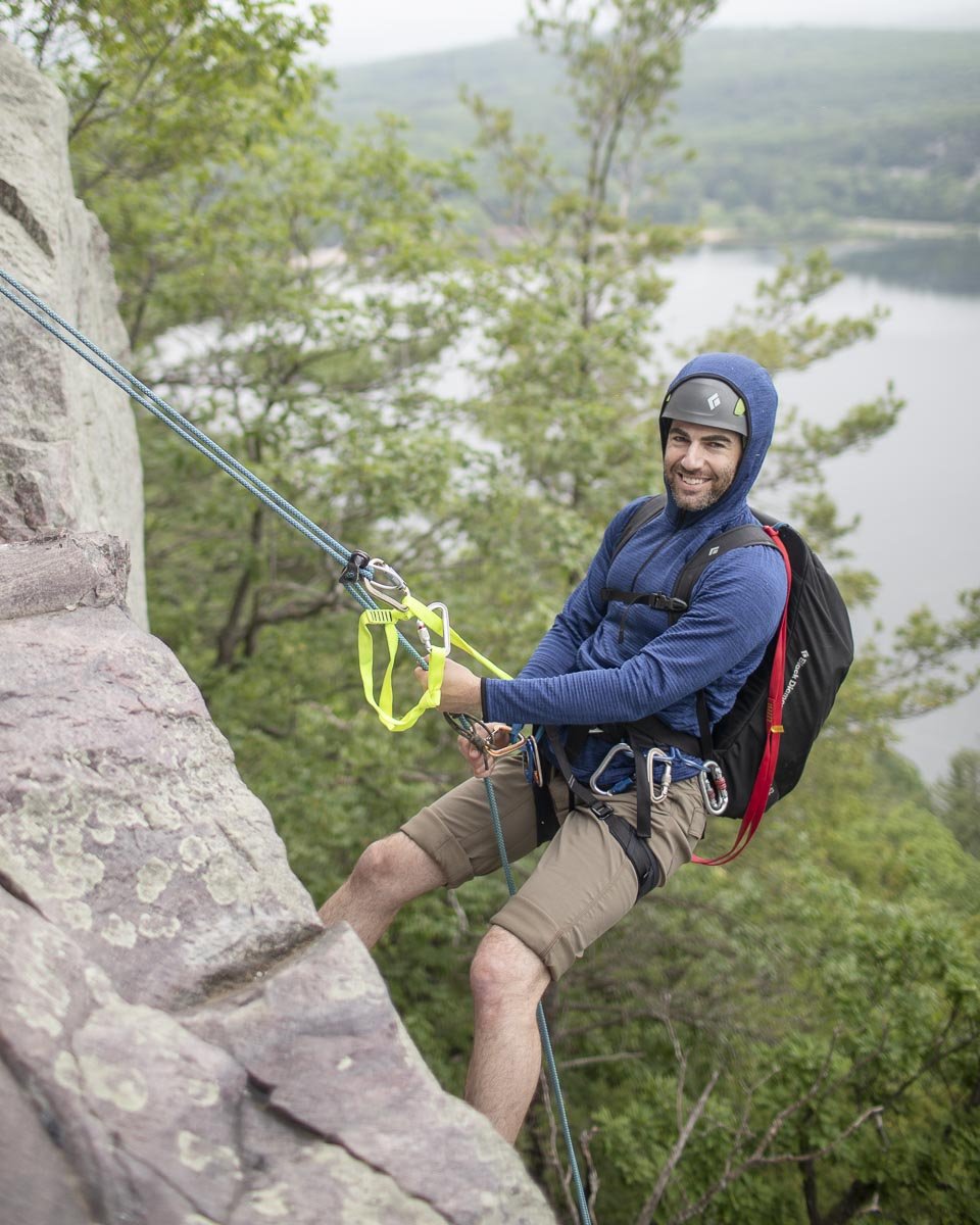  Charlie descends a 90’ rappel on the West Bluff, high above Devil’s Lake. 