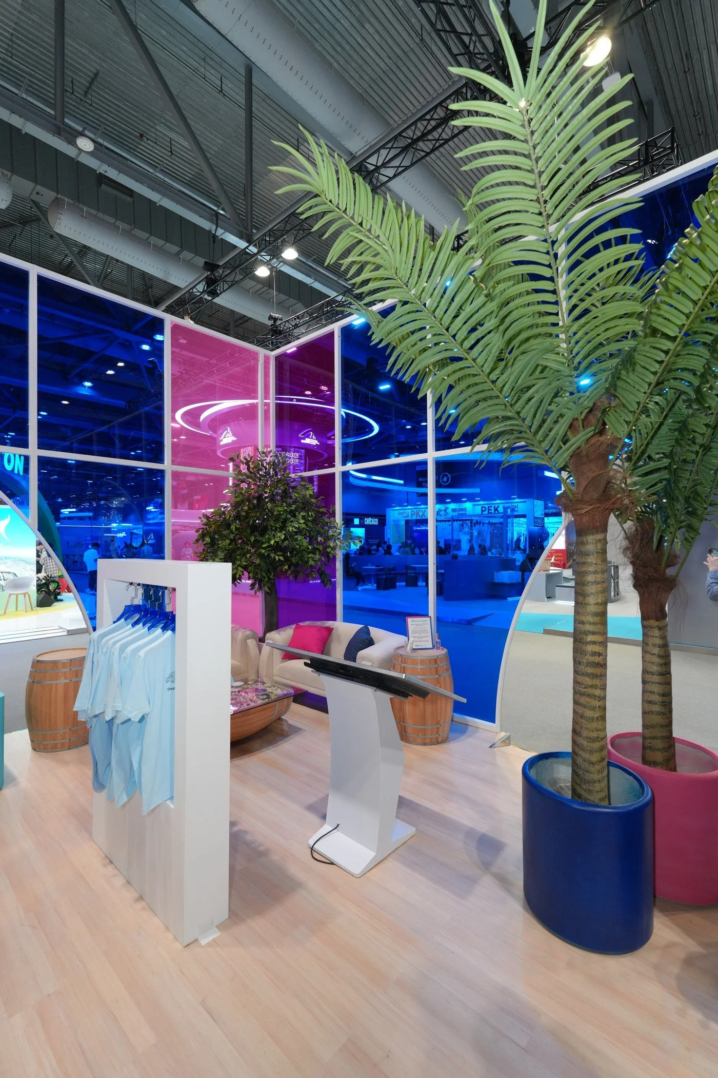 Routes World 2025 Booth, Hong Kong. Interior showing custom t-shirt screen print selection station.