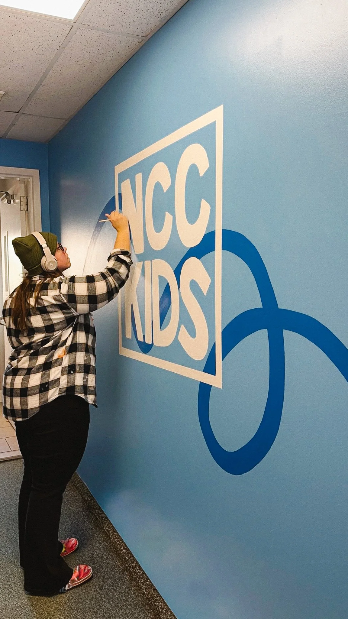 Paxton painting NCC Kids Logo Mural