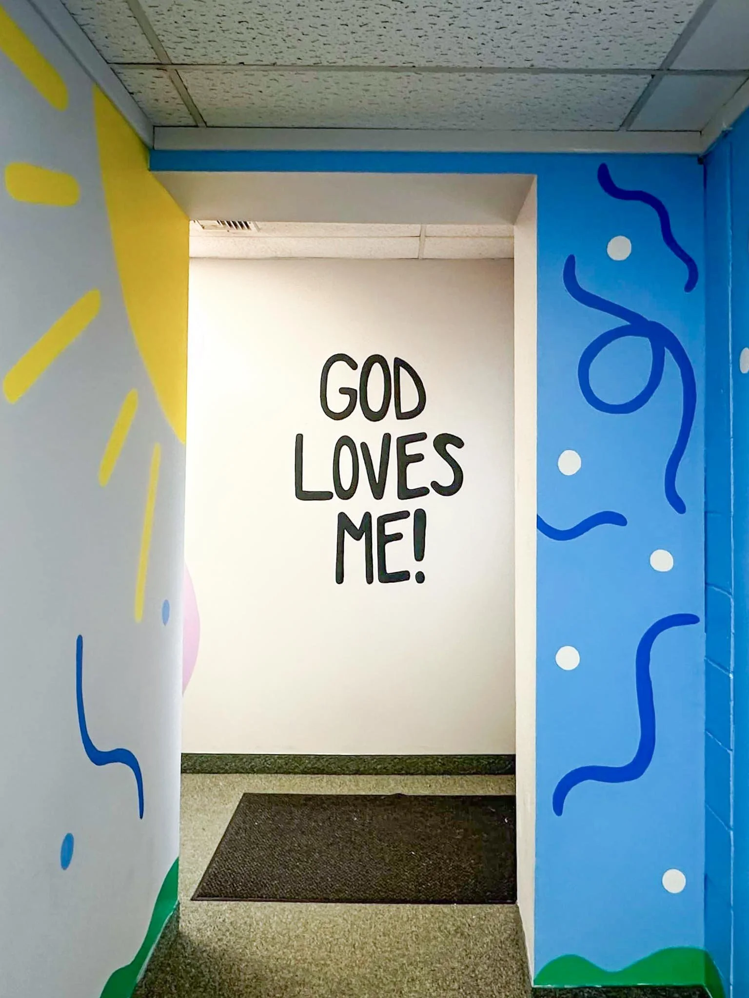 PCC-NCC-Kids-Mural-down-hallway-2.jpg