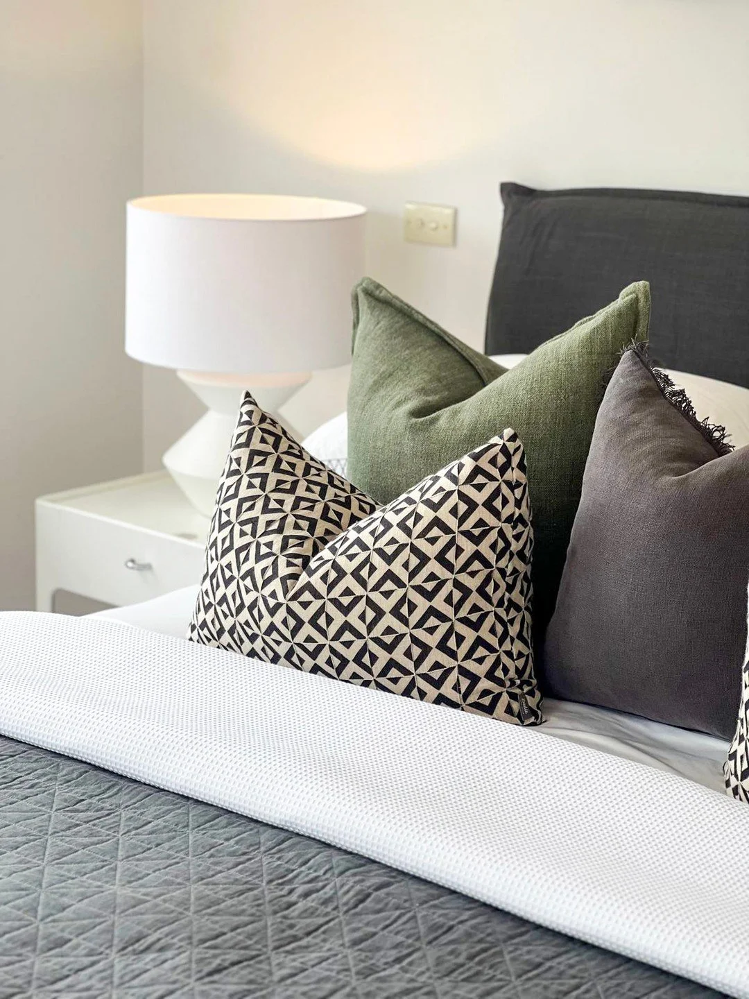 Styling a bedroom isn’t about stuffing it with fluff. It’s about making people imagine their Sunday sleep-in right here.