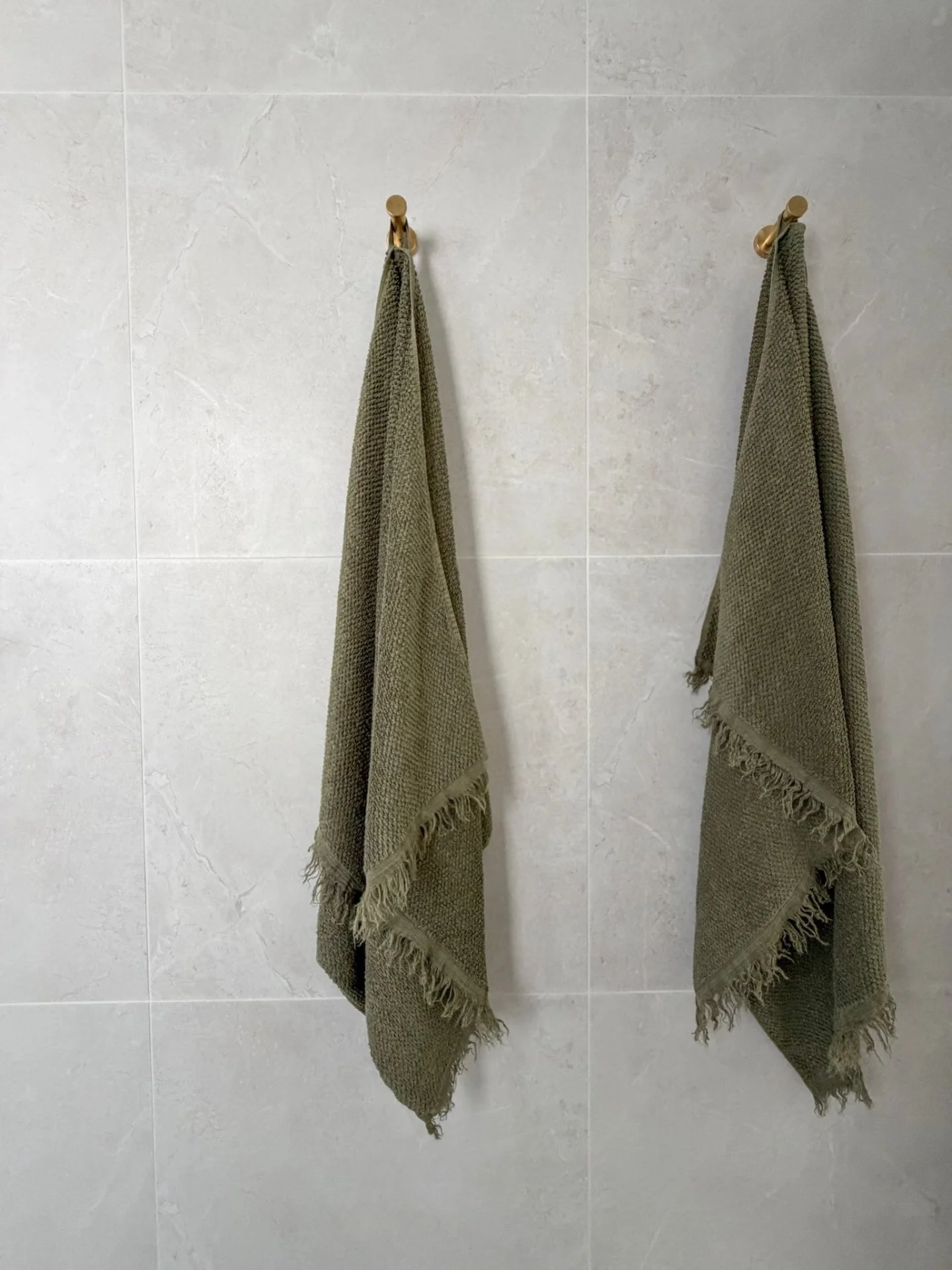 A carefully styled bathroom where tactile finishes and understated elements work together to evoke a sense of everyday luxury.