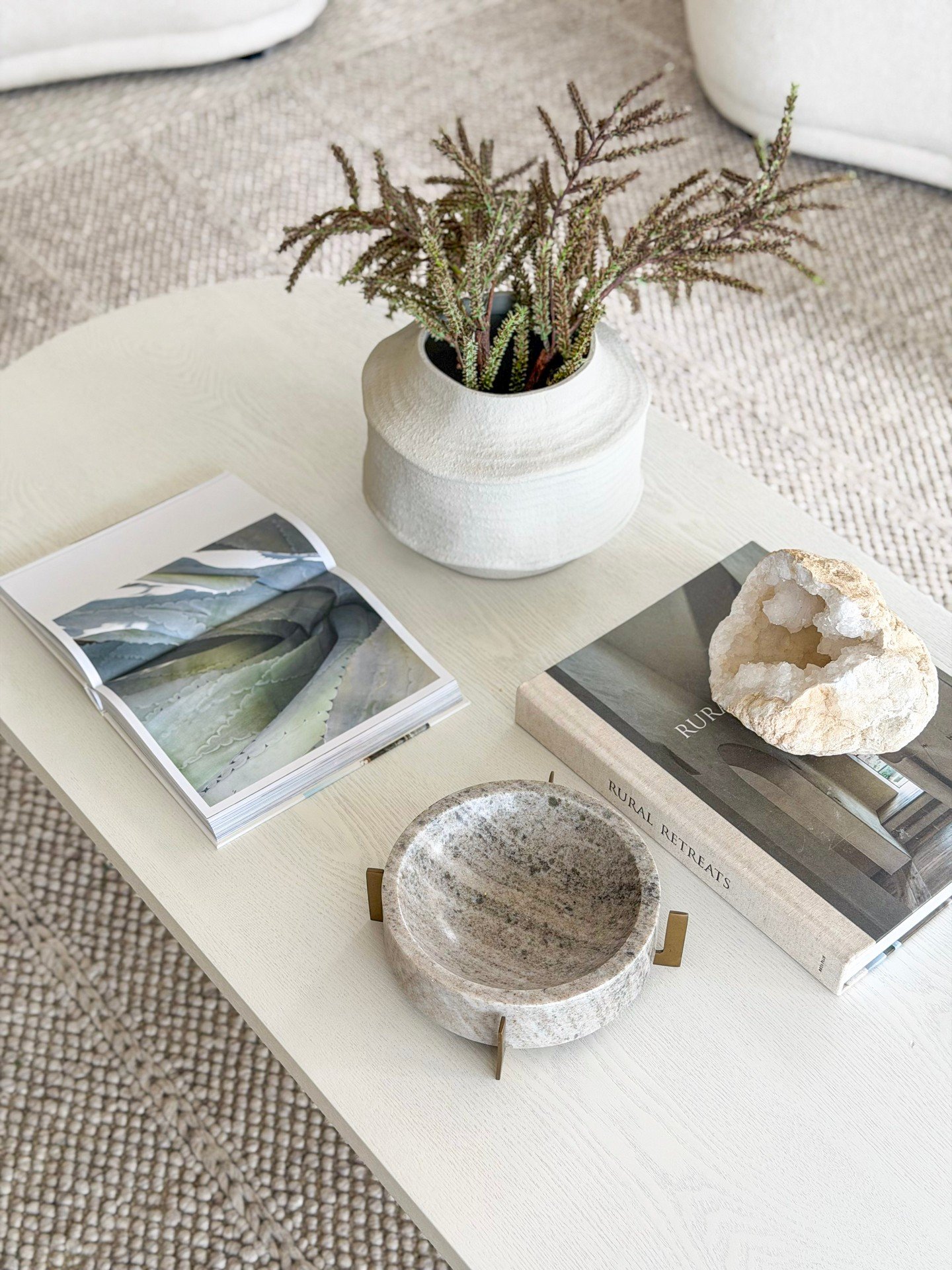 Coffee table styling designed with intention, where texture and tone are curated to complement the space without overwhelming it.