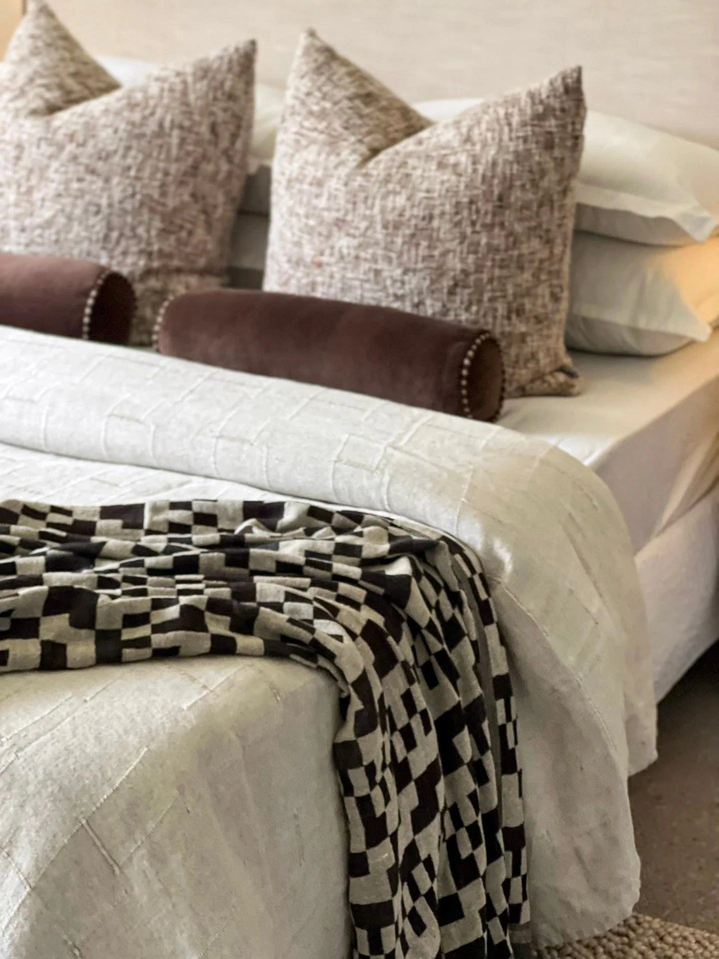 The kind of layering that makes a bedroom feel settled the moment you walk in.
