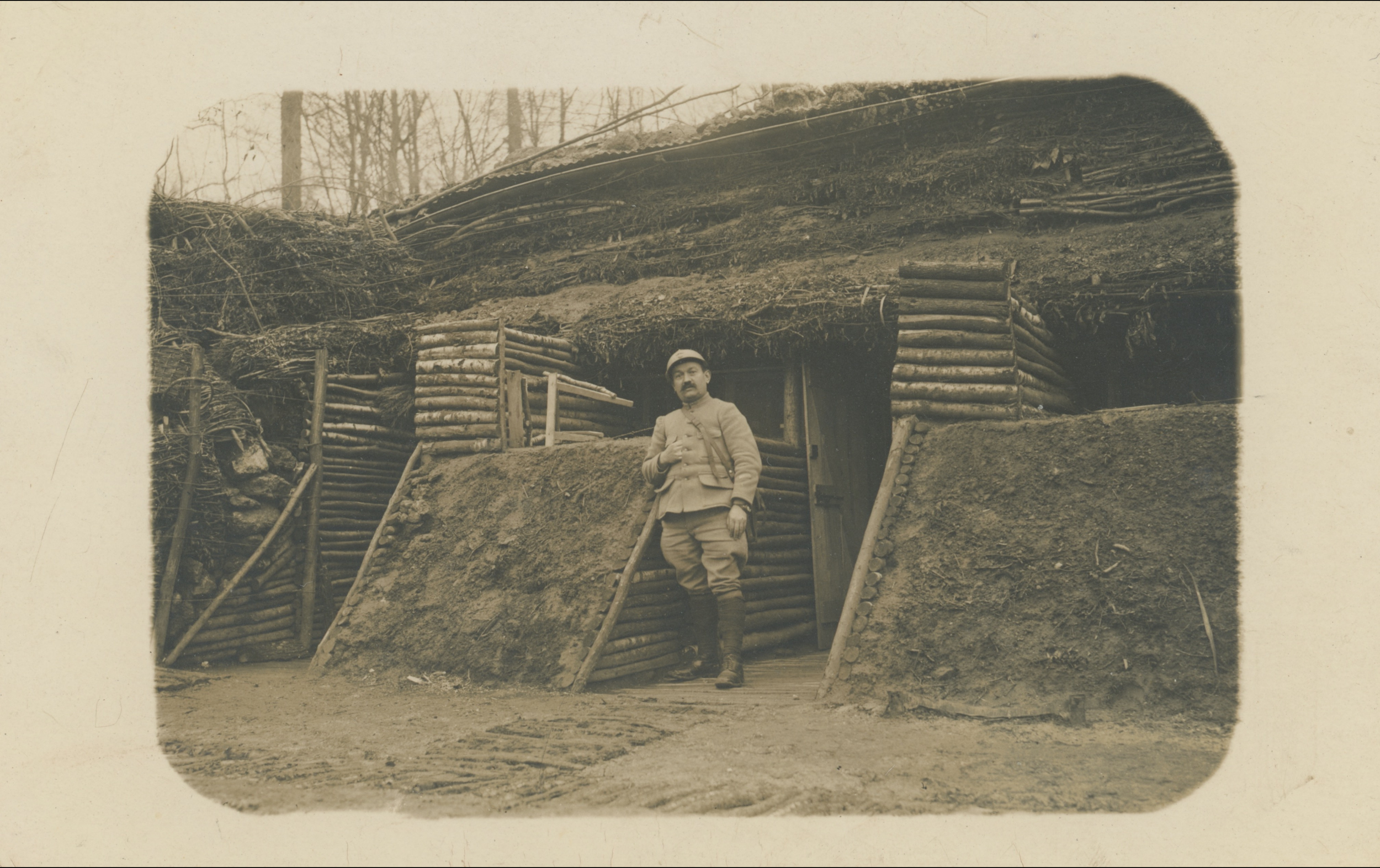 (16.40.A) Portrait of infantryman Léonard PESTOUR in front of a shelter
Date: January 18th 1916
Location: ?
Unit: 295th Territorial Infantry Regiment
Author: Léonard PESTOUR
Present in the photo: 
1. Léonard PESTOUR (Mle 1429)
FM:  tinyurl.com/shw6yb