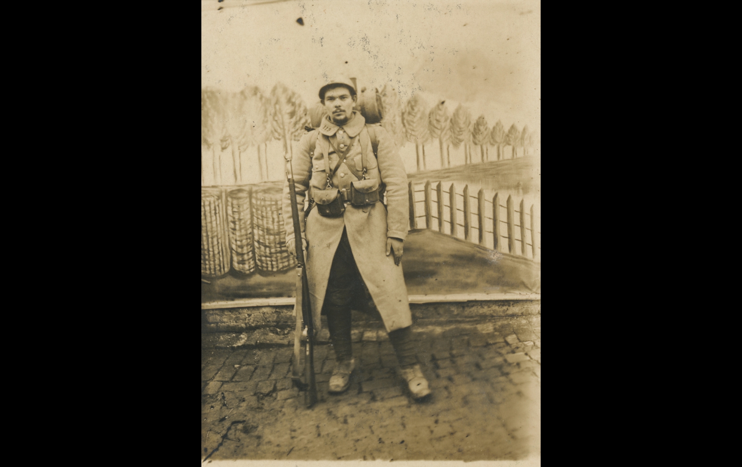 (15.11.A) Portrait of infantryman Joseph Marie BABONNEAU
Date: December 10th 1915
Location: Studio
Unit: 119th Infantry Regiment
Author: Joseph Marie BABONNEAU
Present in the photo: 
1. Joseph Marie BABONNEAU (Mle 973)
FM:  tinyurl.com/ye535es8 