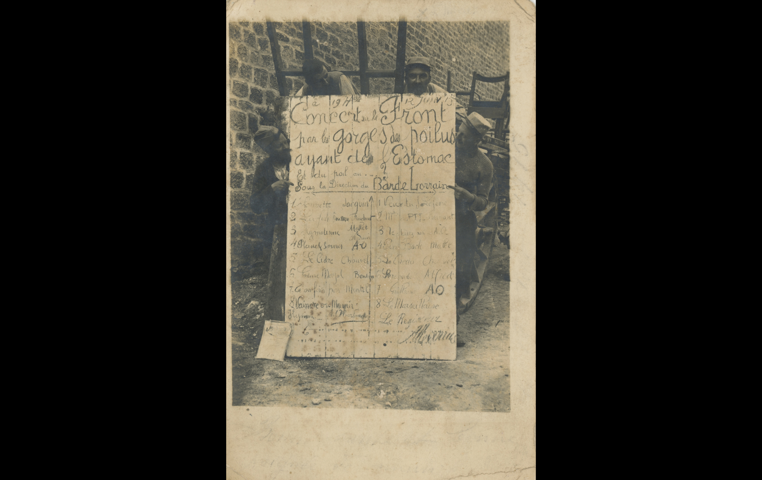 (15.24.A) Photo of soldiers holding a concert sign
Date: June - August 1915
Location: ?
Unit: ?
Author: ?
Present in the photo: ?