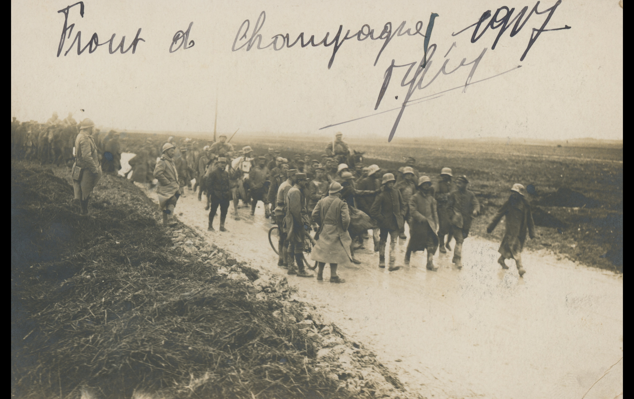 (POW.6.A) Photo of French soldiers escorting German prisoners 
Date: April 28th 1917
Location: Champagne, France
Unit: ?
Author: ?
Present in the photo: ?