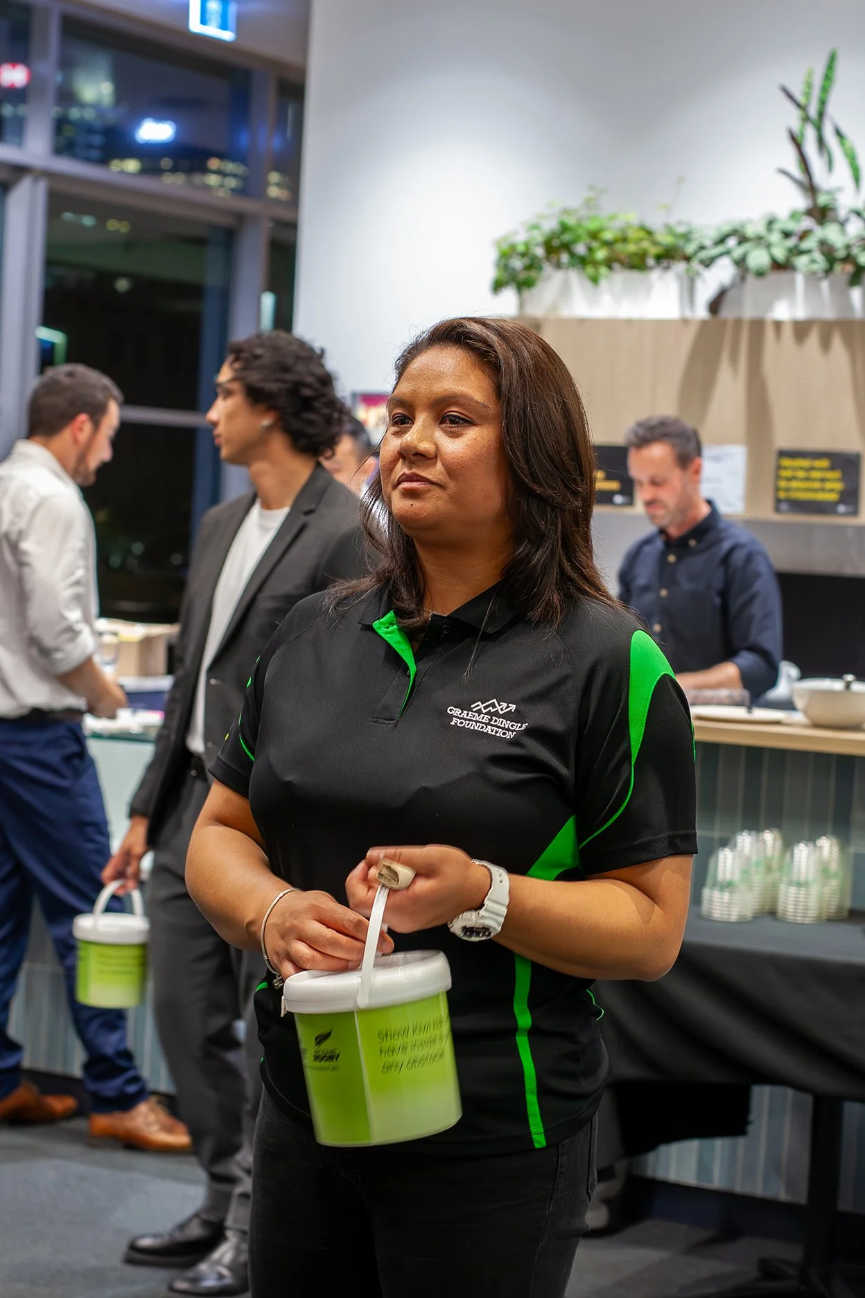 a woman fundraising at a Graeme Dingle Foundation event