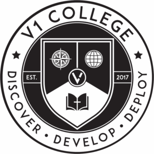 V1 College emblem featuring a shield with a target, globe, and open book, surrounded by the text 'V1 College' and the motto 'Discover, Develop, Deploy', established in 2017.