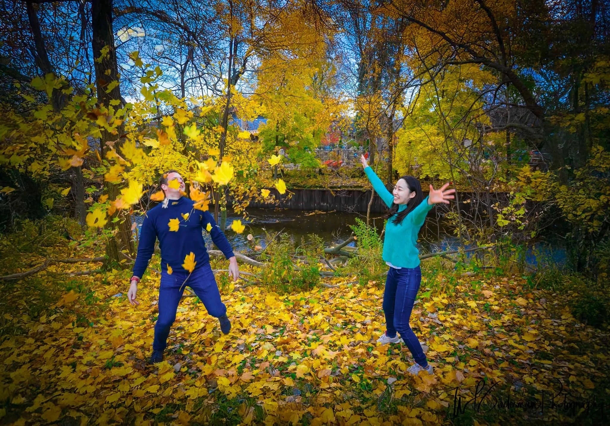 Falling in love with autumn in Chicago! Sometimes the best engagement photos aren't posed at all — they're the moments when a newly engaged couple lets loose, tosses a handful of colorful autumn leaves into the air, and simply enjoys being together!
