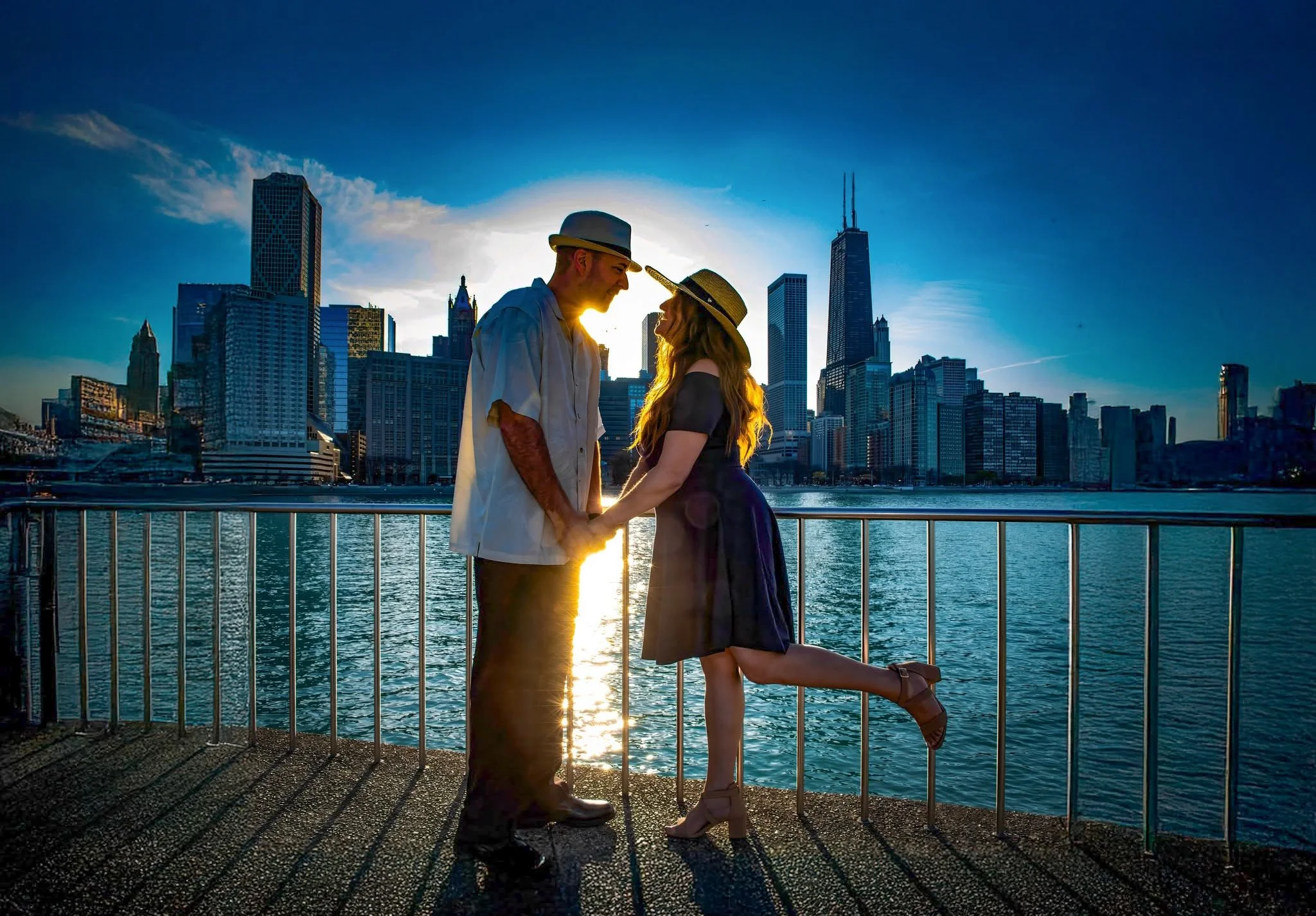 Love shines brightest during Chicago's golden hour! 💍🌅❤️ This newly engaged couple shares a romantic kiss at Milton Lee Olive Park, silhouetted against the warm glow of the setting sun and Chicago's spectacular downtown skyline.

With the shimmerin