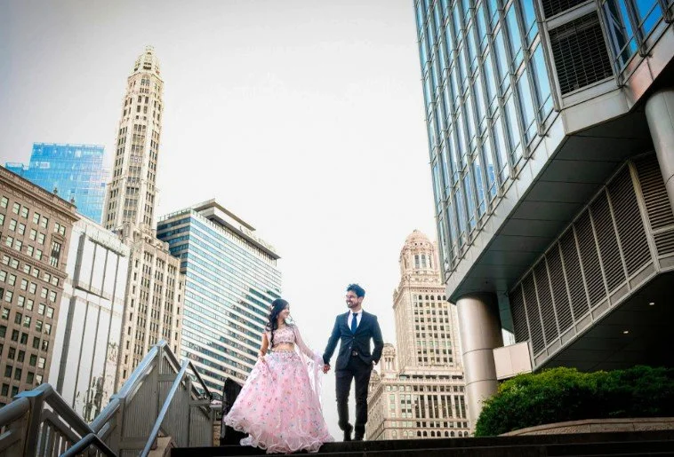 Newly married and stepping out in style along the Chicago Riverwalk! 💍❤️ This elegant couple celebrates their wedding day on the north side of the Chicago River, near the historic Wrigley Building. With Chicago's magnificent architecture, iconic sky