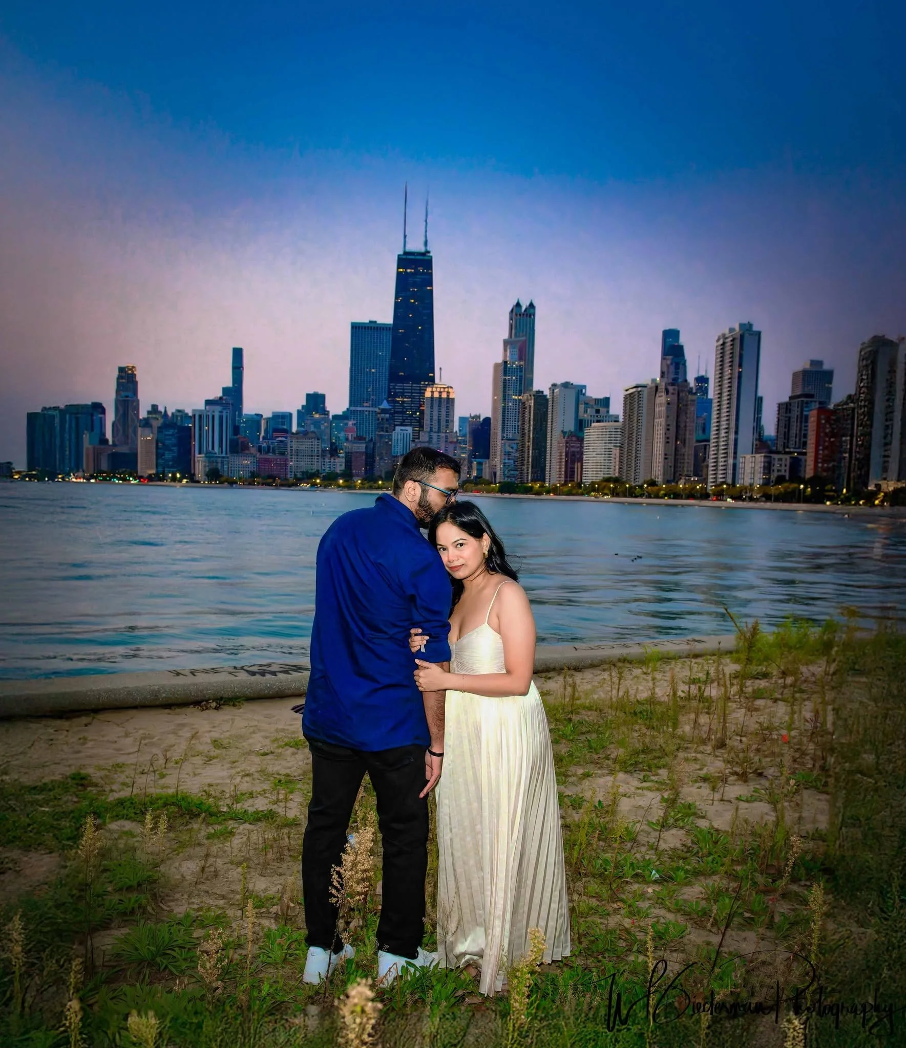 Love, romance, and the Chicago skyline! ❤️💍 This beautiful couple shares a quiet moment during their save-the-date photography session at North Avenue Beach, with Lake Michigan and Chicago's iconic skyline providing a breathtaking backdrop. As the e