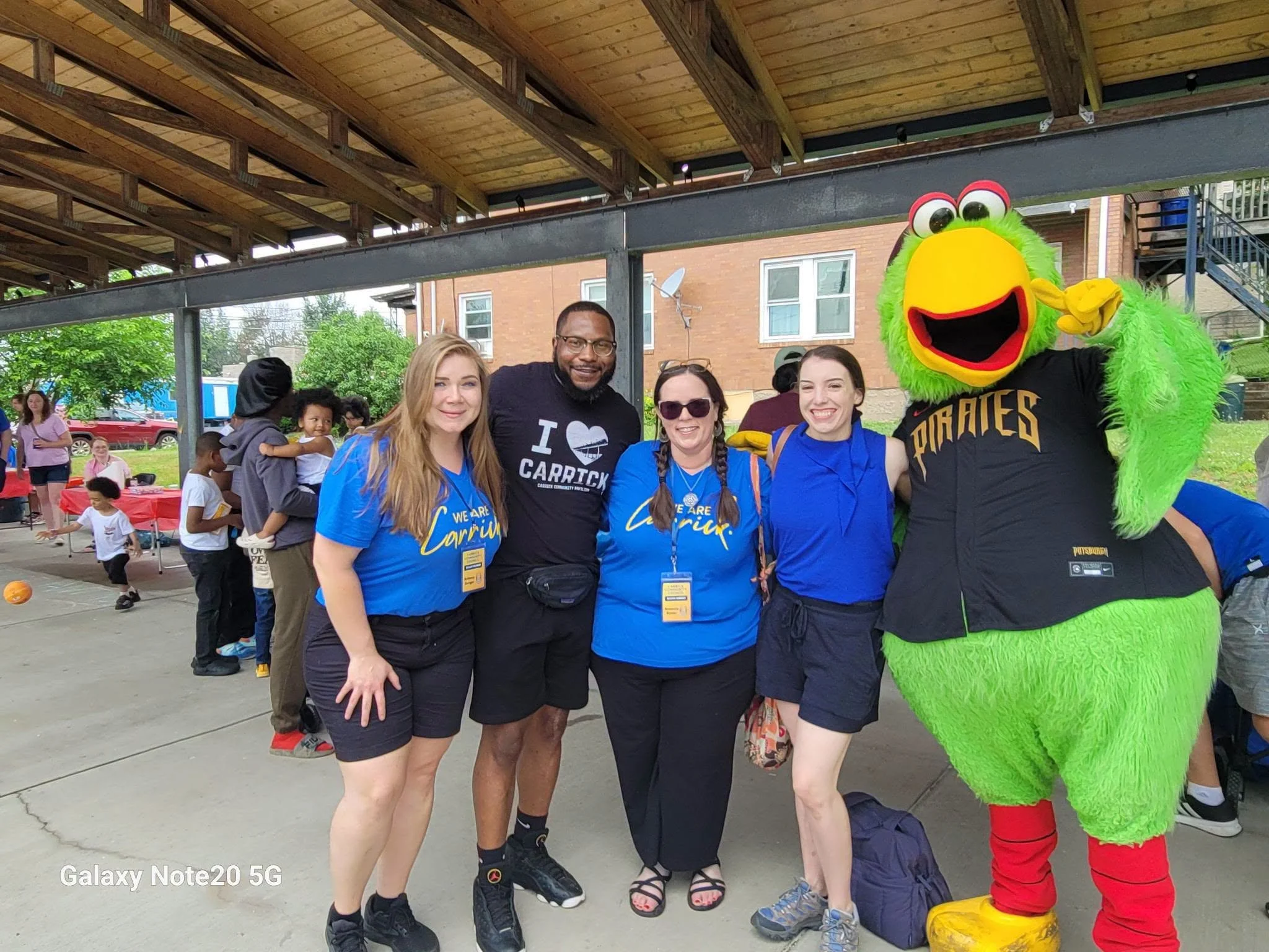 Four people and the Pirates Parrot posing for a picture at SummerFest June 27, 2026.