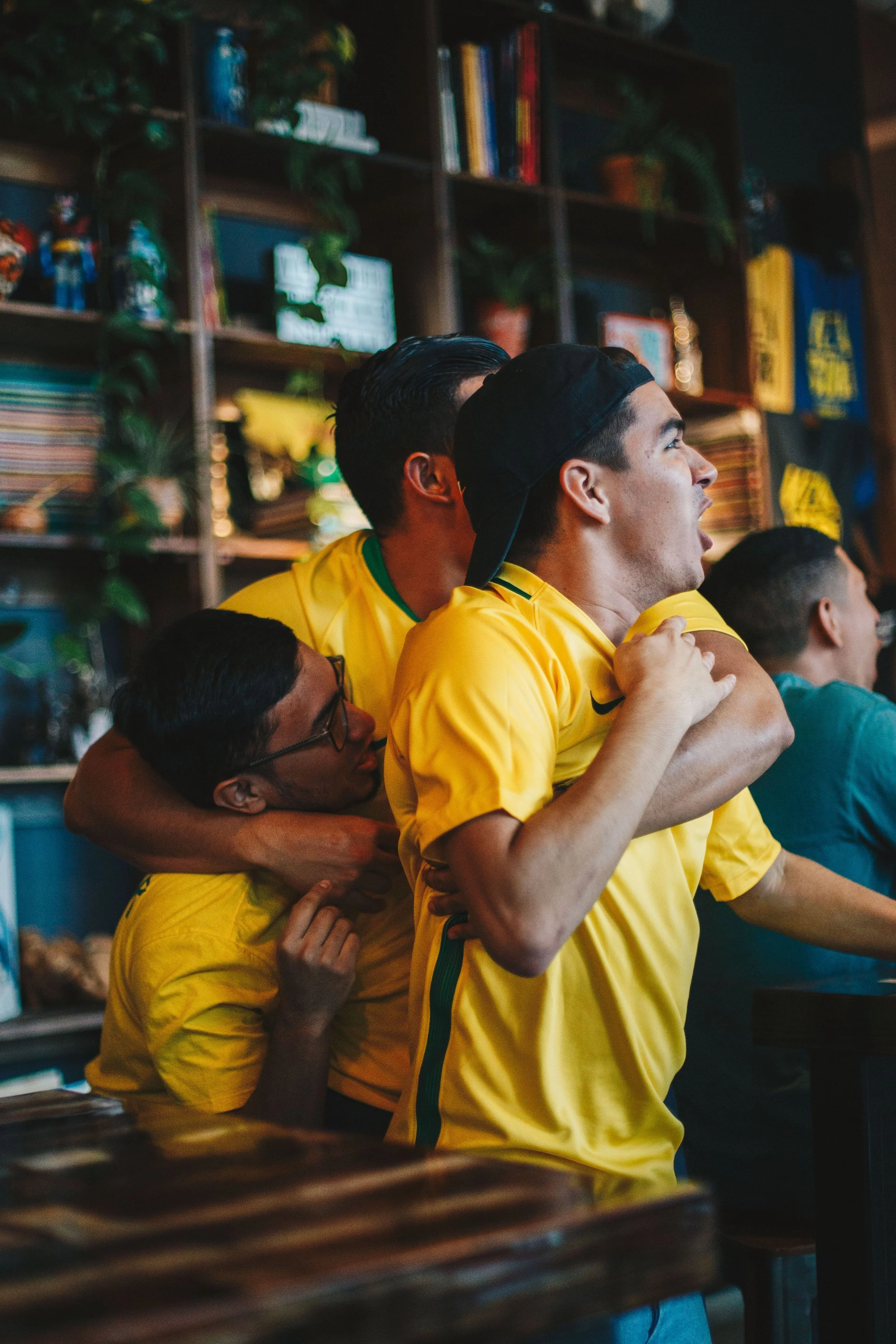 Men cheering and expecting goal at a bar.jpg