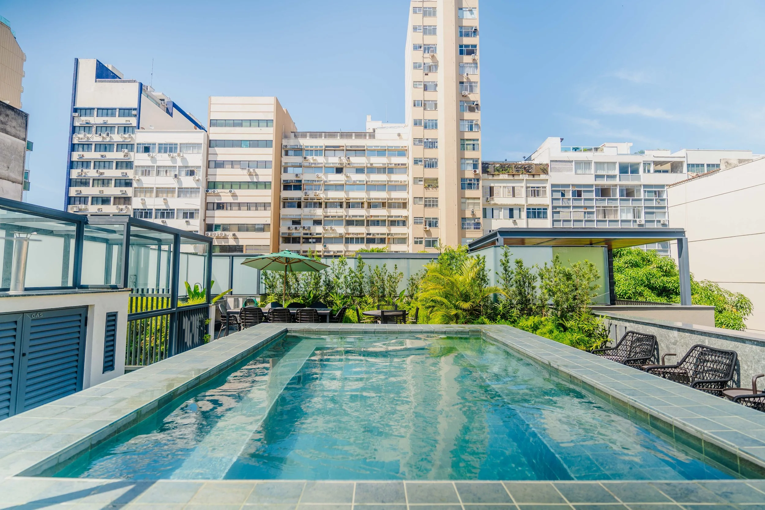 A serene photo of the building's rooftop pool area