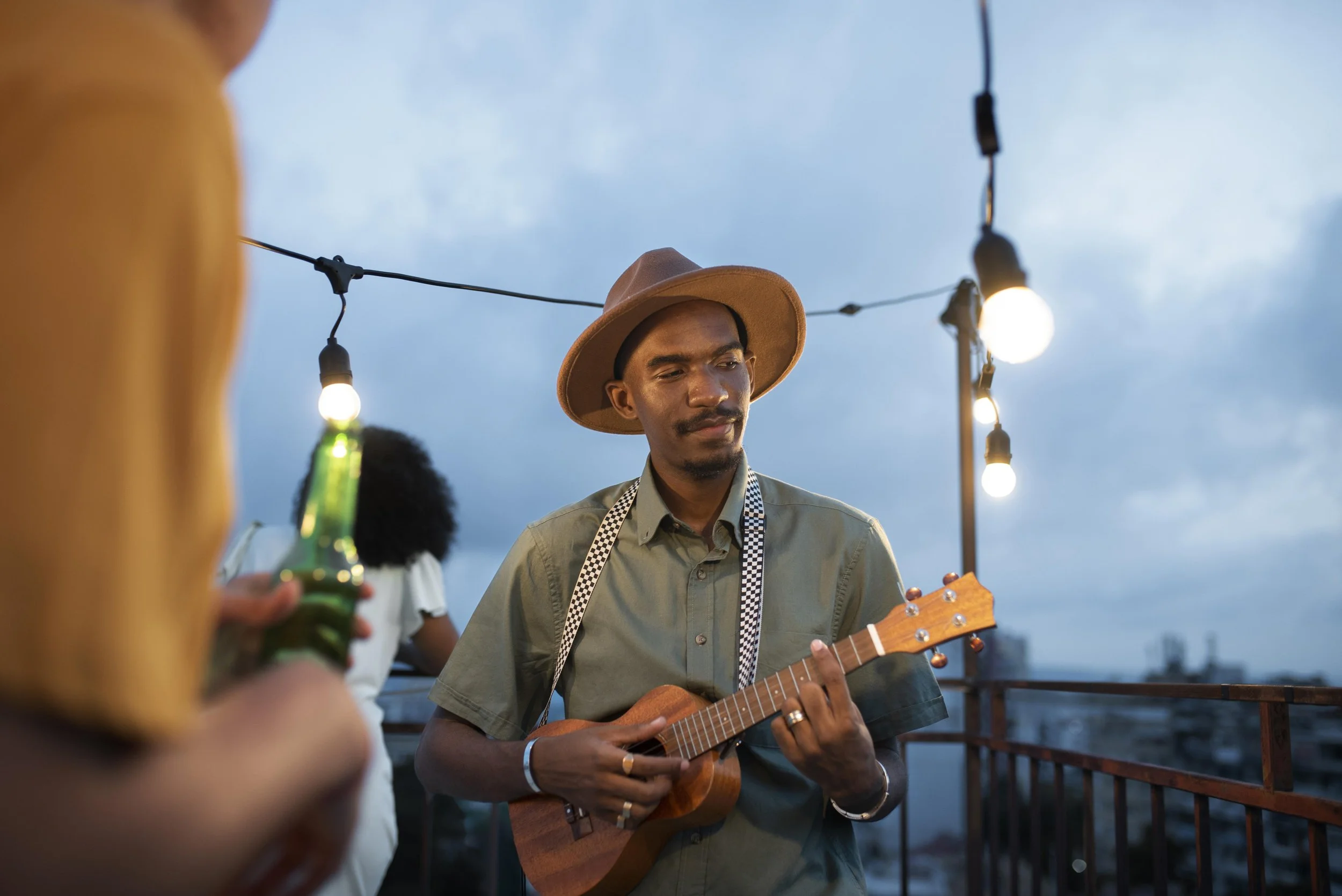 Bohemian moment where a man plays ukelele