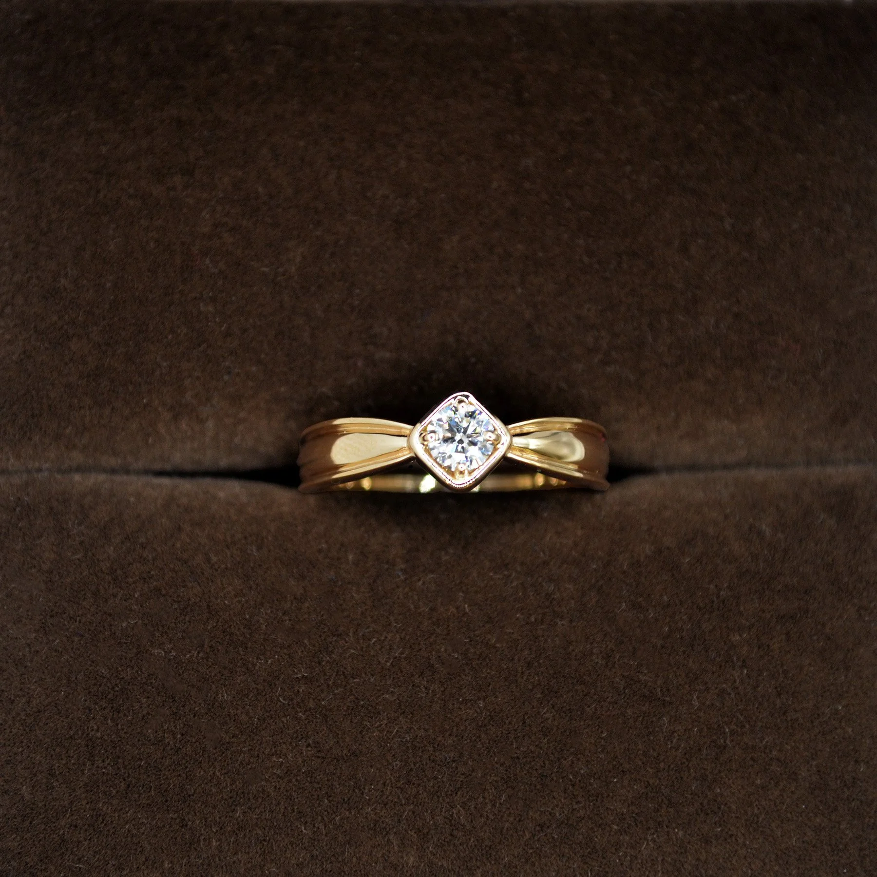 An elegant yellow gold diamond ring made in memory of a loved one.