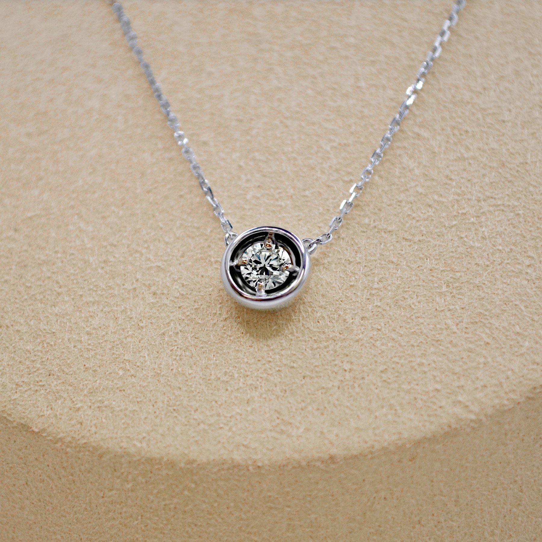 A cosmic-inspired silver pendant with a blue cremation diamond, symbolizing eternal love and memories.