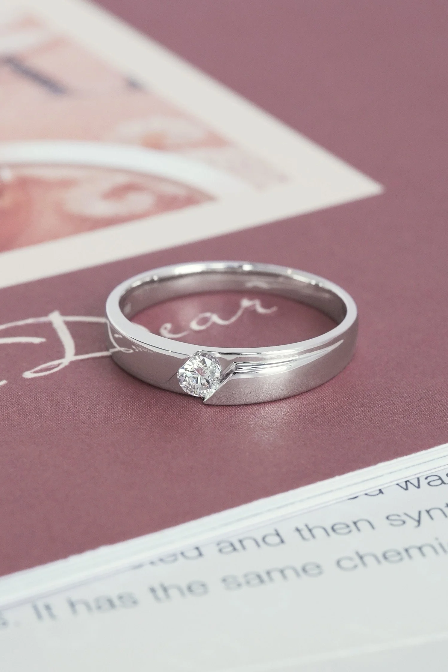 Refined platinum ring with a sparkling diamond centerpiece, paired with a subtle matte finish for a timeless appeal.