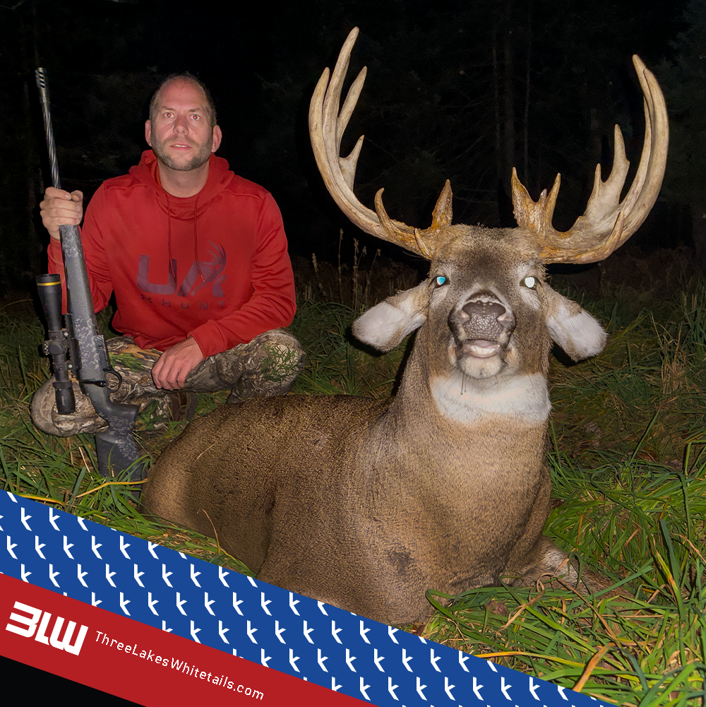 Jason at Three Lakes Whitetails using the Rack Jak Stand with a nice buck