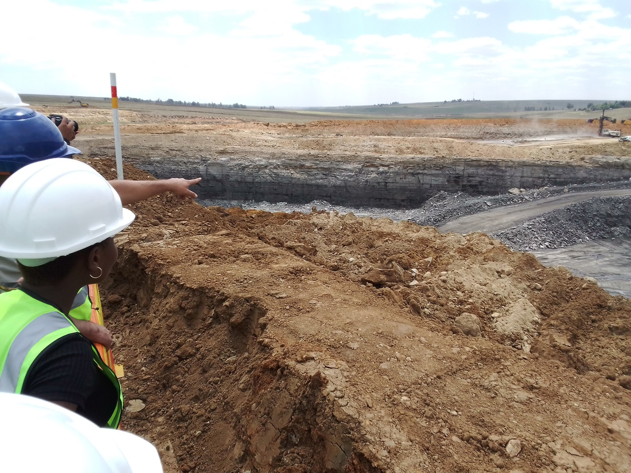  Participants and Gugulethu mine staff at a mine pit for an information session 