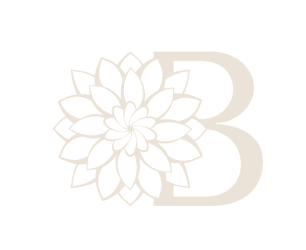 A soft white capital B with a dahalia over the long edge of the B
