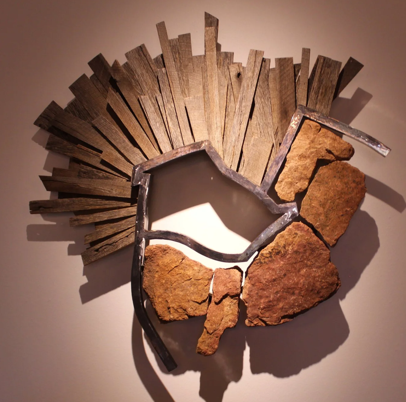 Pat Musick (American 1926) “Bonnet”, 1995, stone steel and wood, gift of Pat Musick and Jerry Carr, 2006 (36’’ H x 41’’ W x 5 ½’’D) 