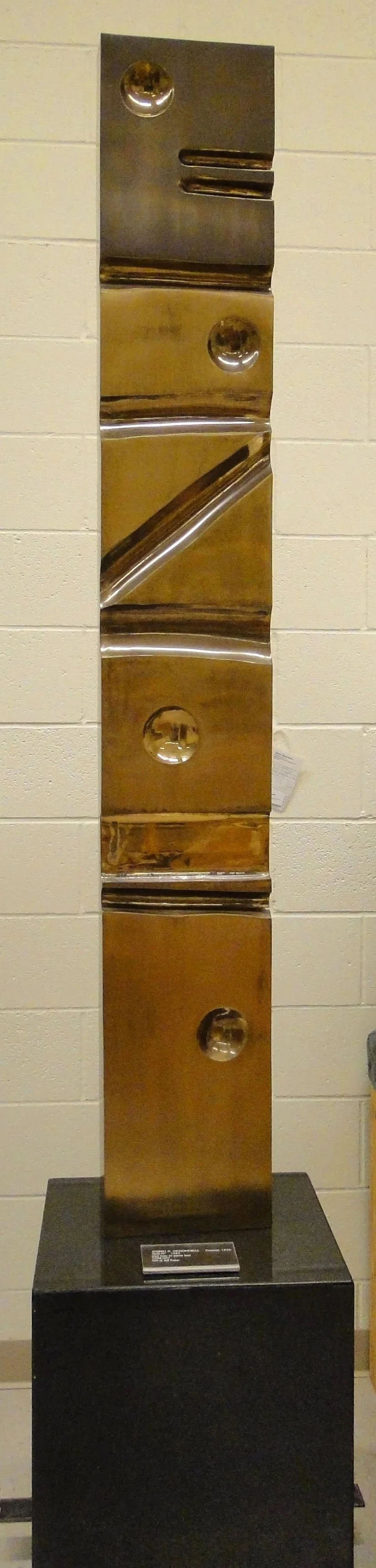 Joseph McDonnell (American 1936) “Stella IV”, 1983, brass, stone, gift of Jeff Parker, 1998 (6’ H x 10 ½’’ W x 3 ¼’’ D) 
