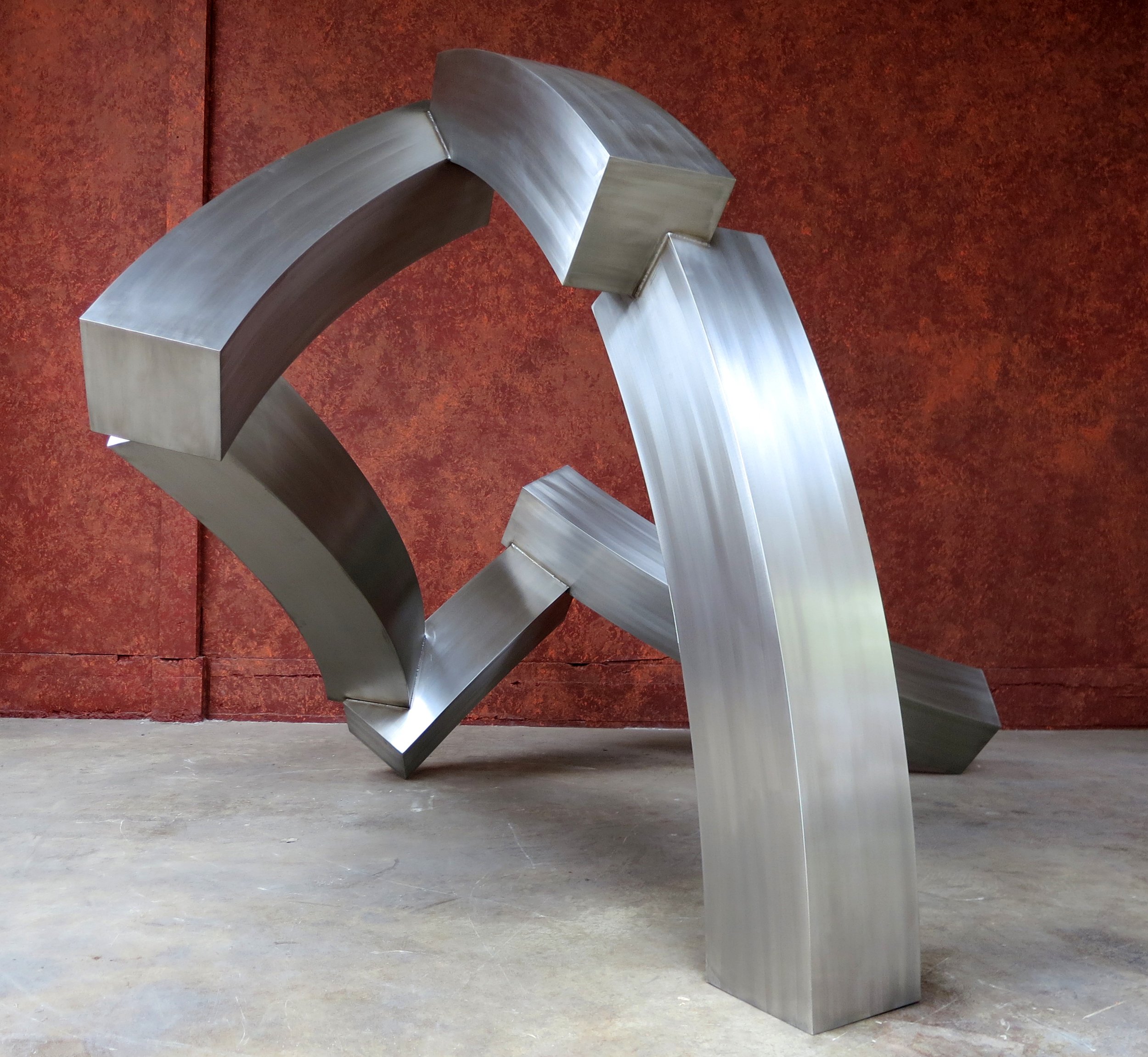 Brian Wall (British/American 1931) “Brewin”, 2012, stainless steel, gift of Brian Wall, 2025 (144’’ H x 103 x W 101’’D) 
