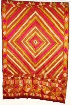 India. Hand-woven phulkari (embroidery) piece from the Punjab in India or Pakistan.  The base fabric is hand-loomed cotton with a heavily embroidered pattern done in raw silk. Concentric Diamond Pattern, referred to as “eye of nightingale” or chesm-e