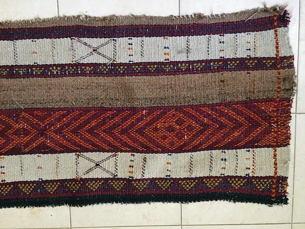 Libya. Bedouin tent cover. The weaving art, composing the customary Bedouin tent, is portrayed as steadily disappearing. With the discovery of immense oil reserves by 1959, the Libyan tribal system and economy gradually evolved, leading impoverished 