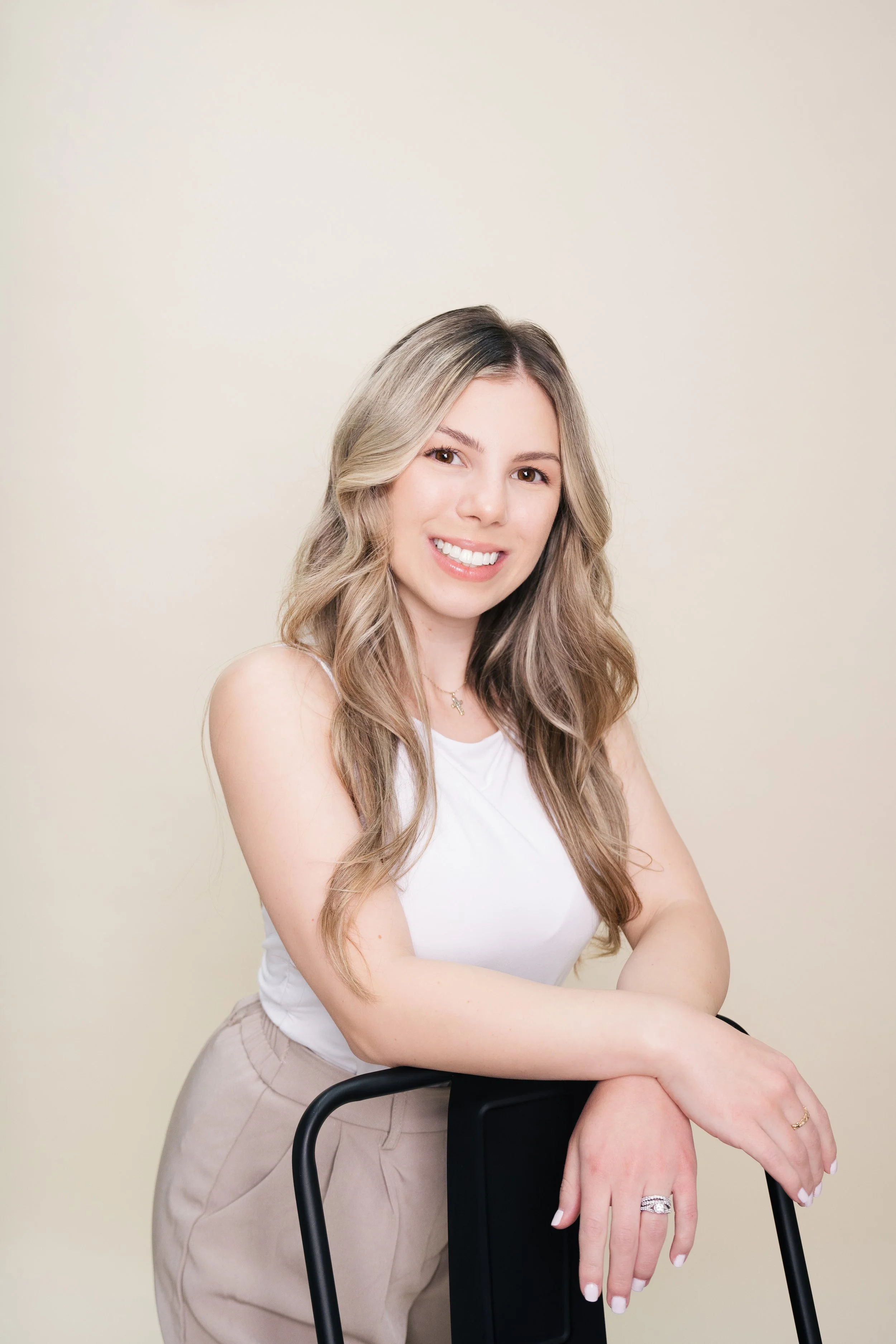 Professional woman leaning on chair