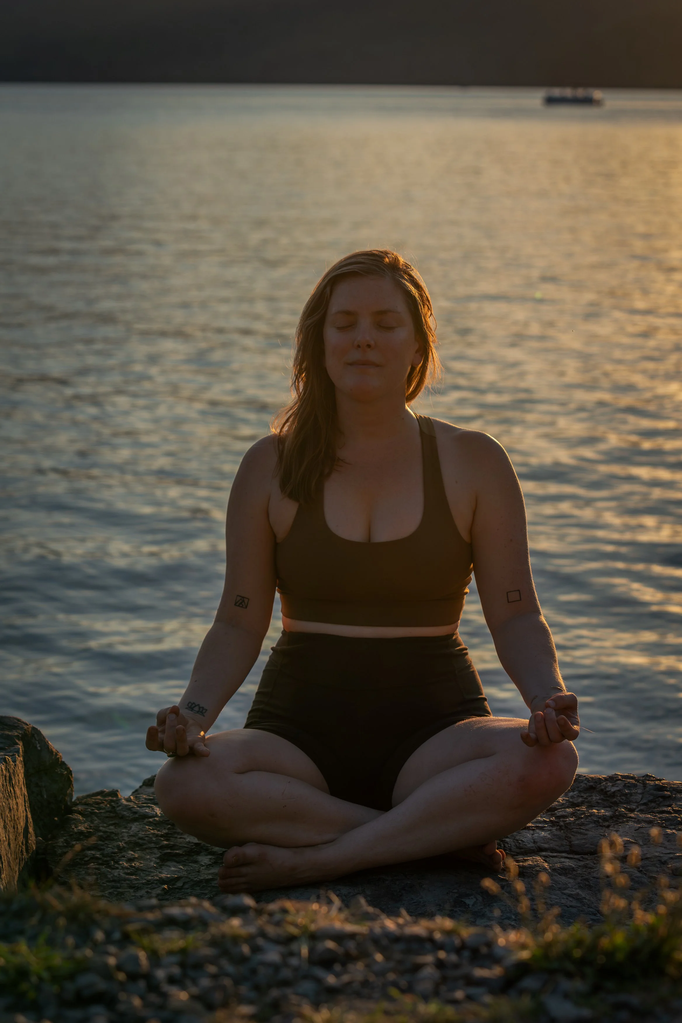 Sitting meditation on rock near lake