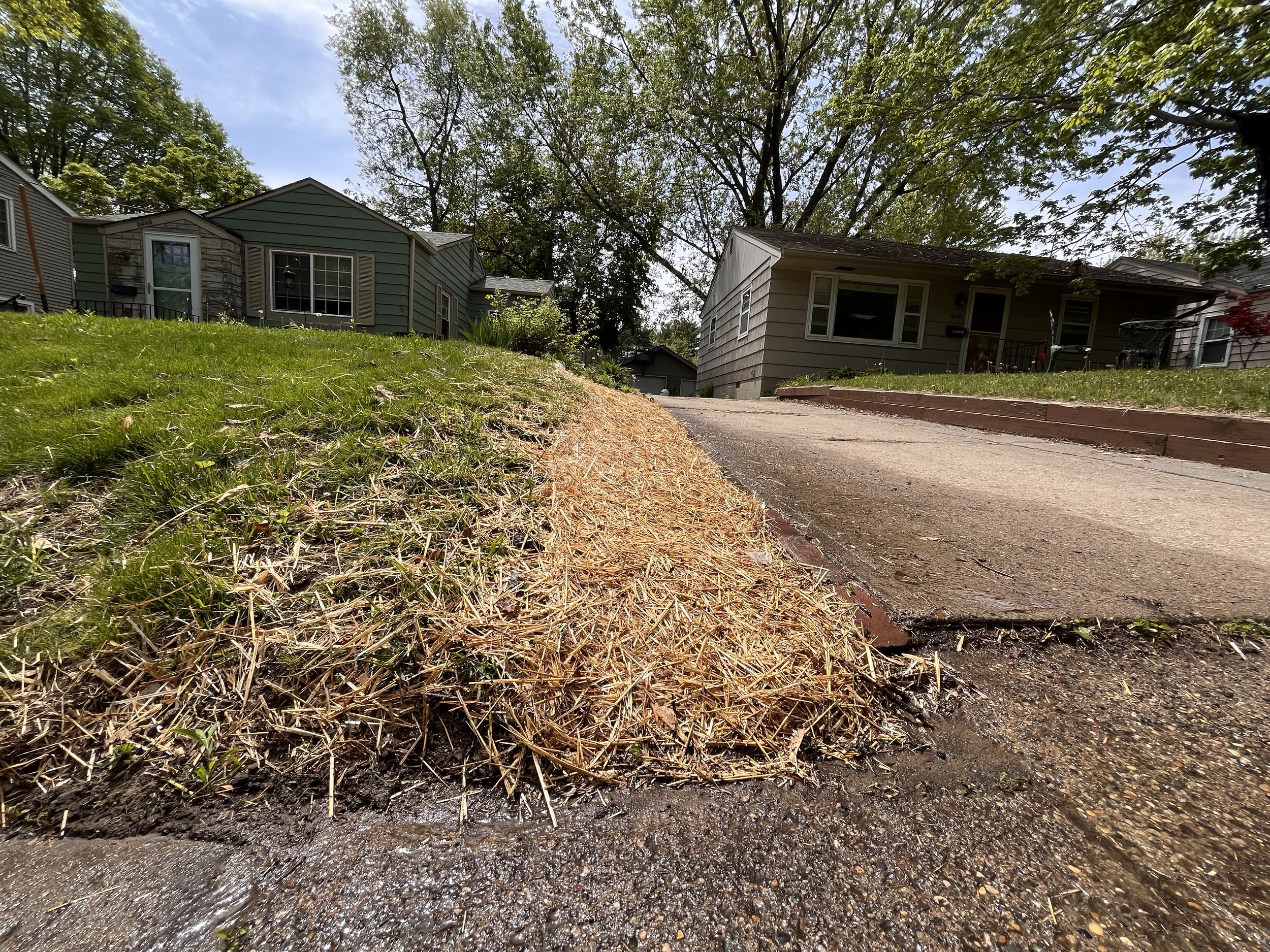 Fixing a bare curb of a lawn by Double Take Lawn Services in Pleasant Hill, IA.