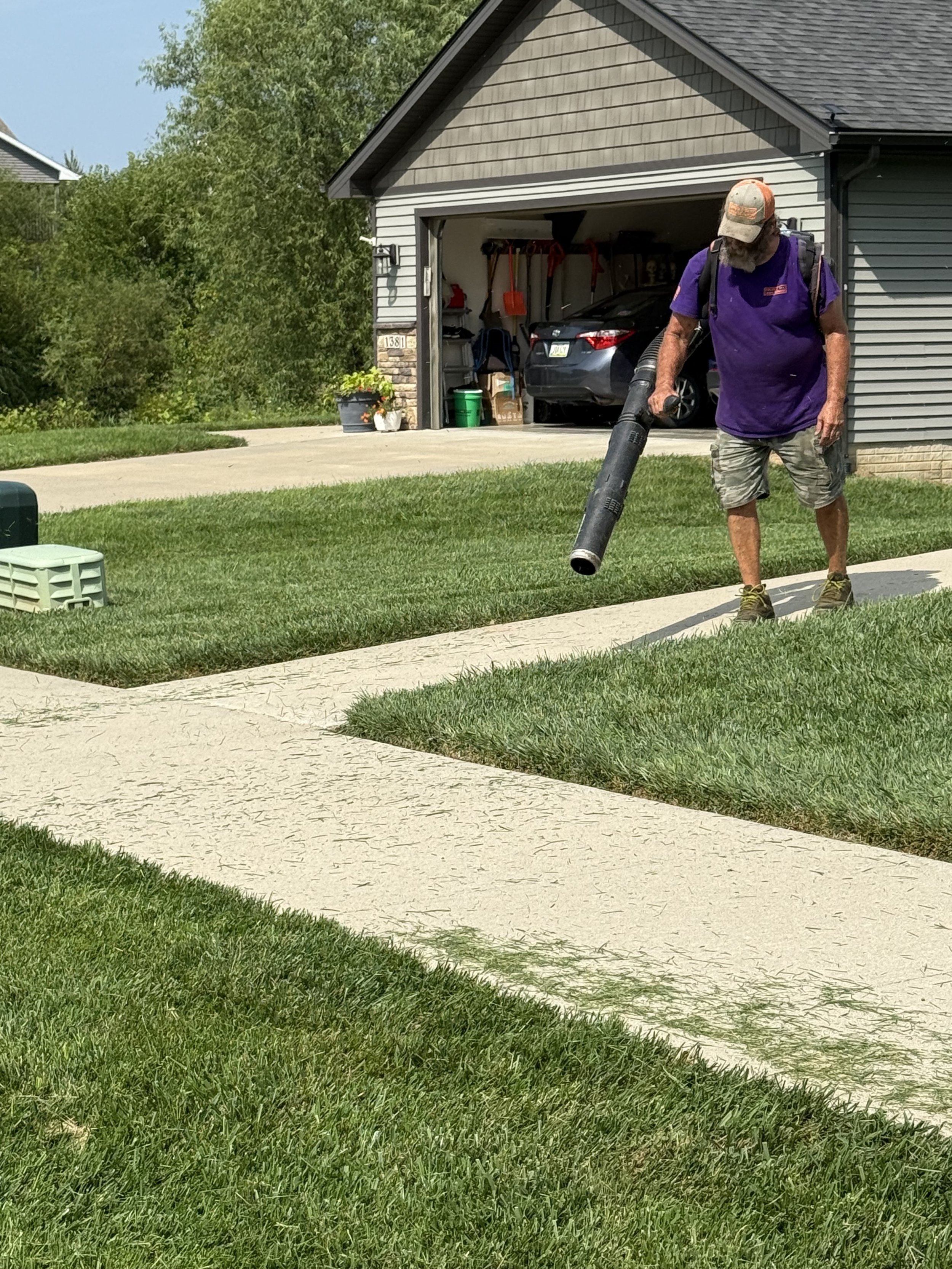 Final tidy of lawn after mowing in Altoona, IA