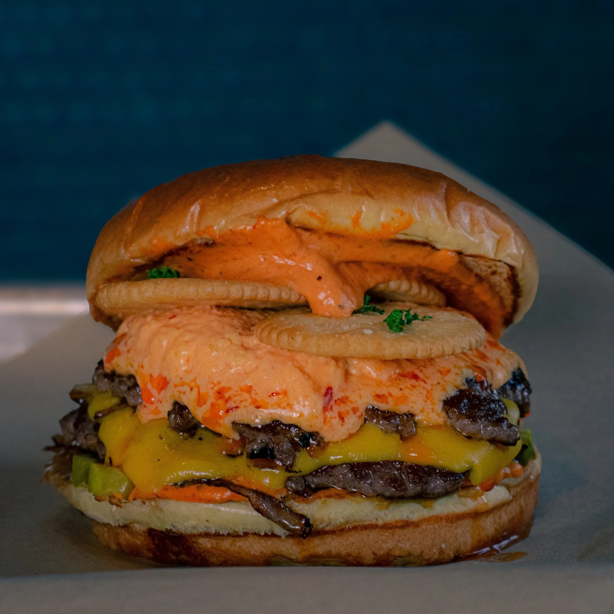 Who hasn't looked a neon-orange, almond coated cheese ball in the eye and fantasized about plopping that entire bad boy on a hot burger? ....Oh, just us? Well, we've shamelessly embraced our holiday hors d'oeuvre fantasy for our December special, the