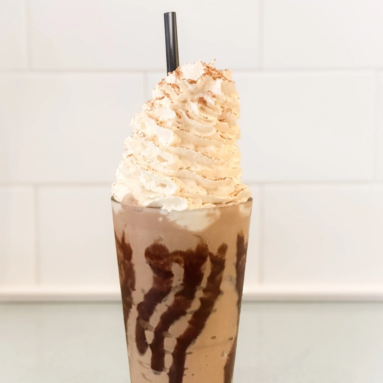 Inspired by the Ethiopian Coffee ceremony we created a milkshake blending coffee and aromatic spices in an homage to the traditional aromas that accompany the ceremony. 

The Ambo Coffee Milkshake features a delight of cardamom, cinnamon, clove, coff