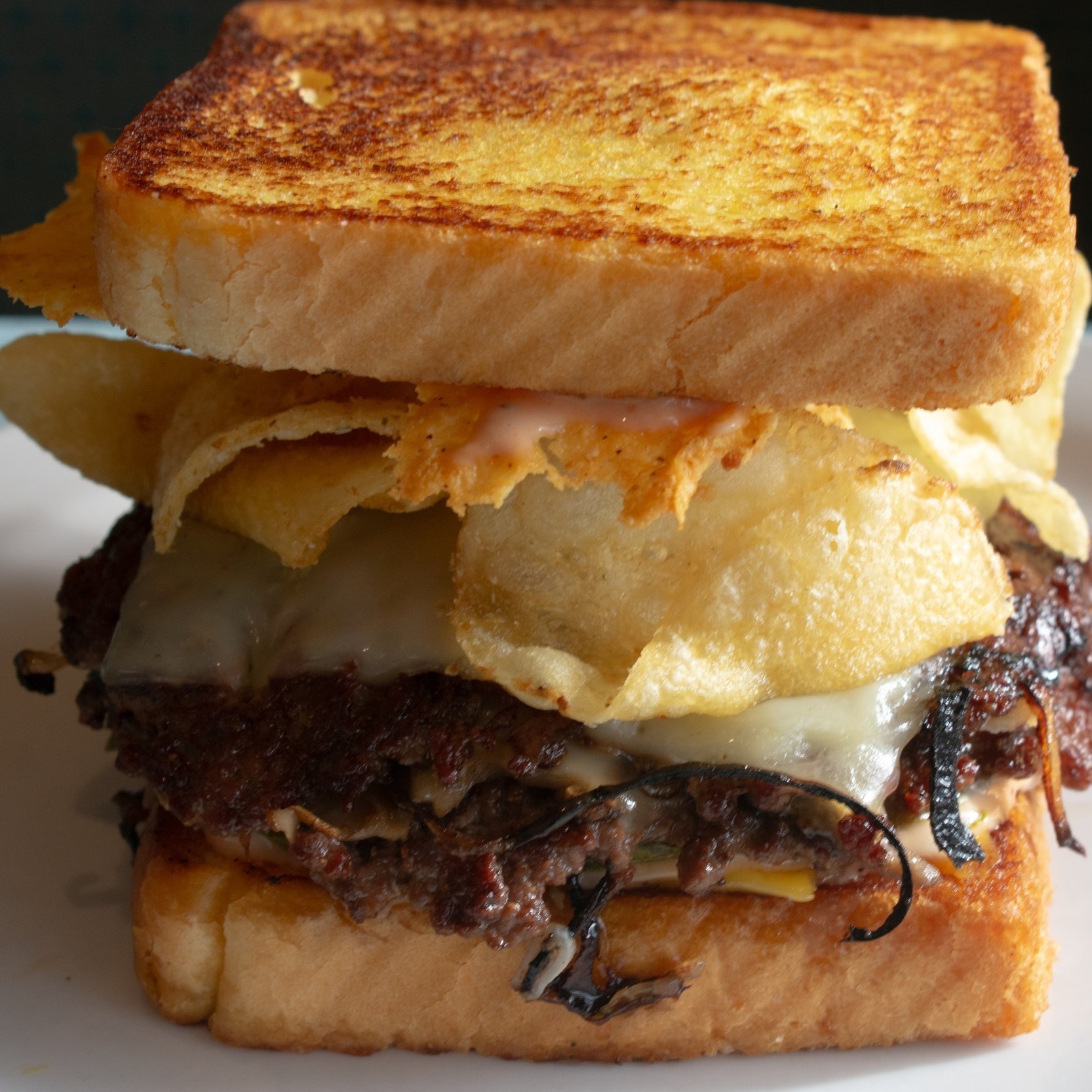 Fiamma Burger Patty melt with swiss, cheese crisps & potato chips
