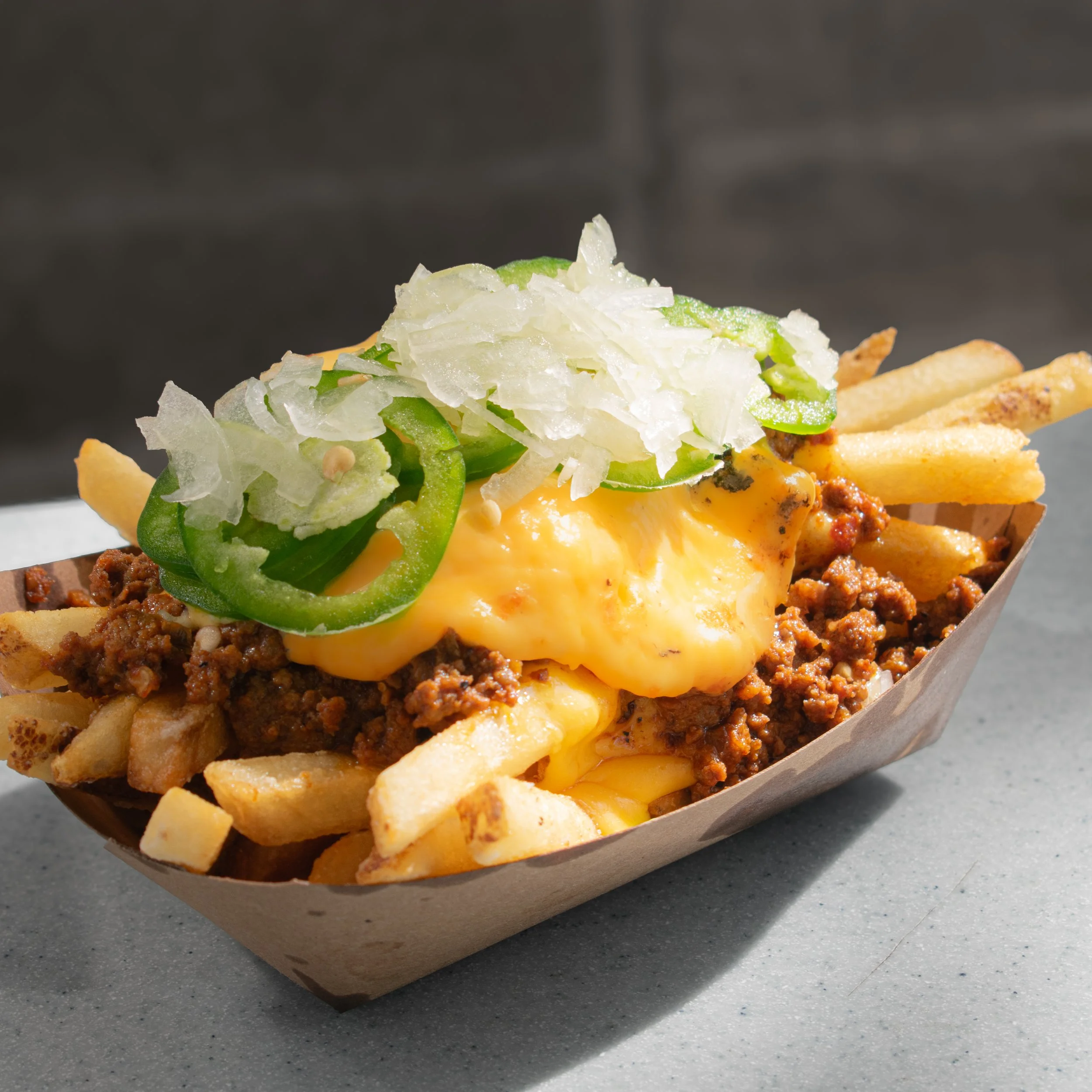 Fiamma Chili Cheese Fries with Chili Con Carne, Queso & Pickled Jalapeno