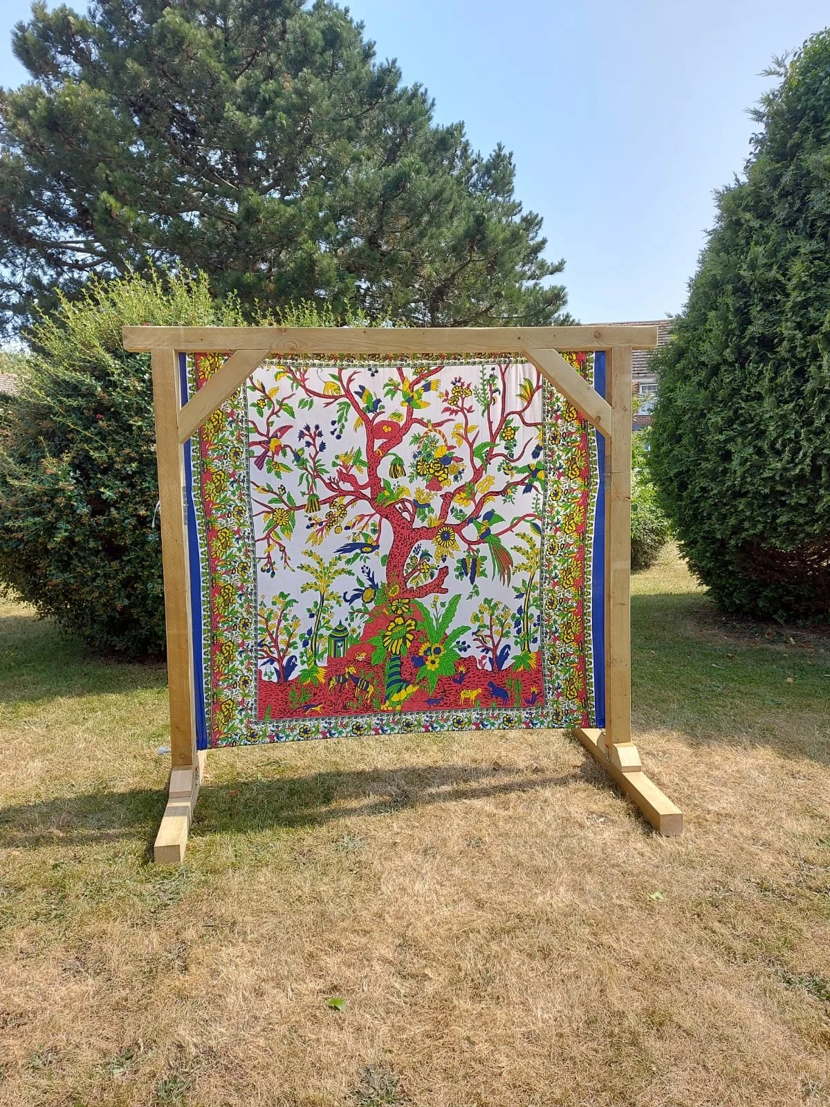 Tree print backdrop on wooden ceremony arch - hire for Mae & Maple