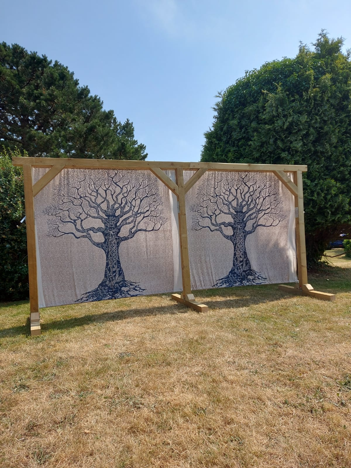 Navy and natural tree print backdrop on wooden ceremony arch - hire for Mae & Maple