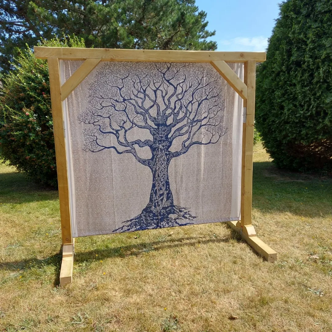 Blue and natural tree print backdrop on wooden ceremony arch - hire for Mae & Maple