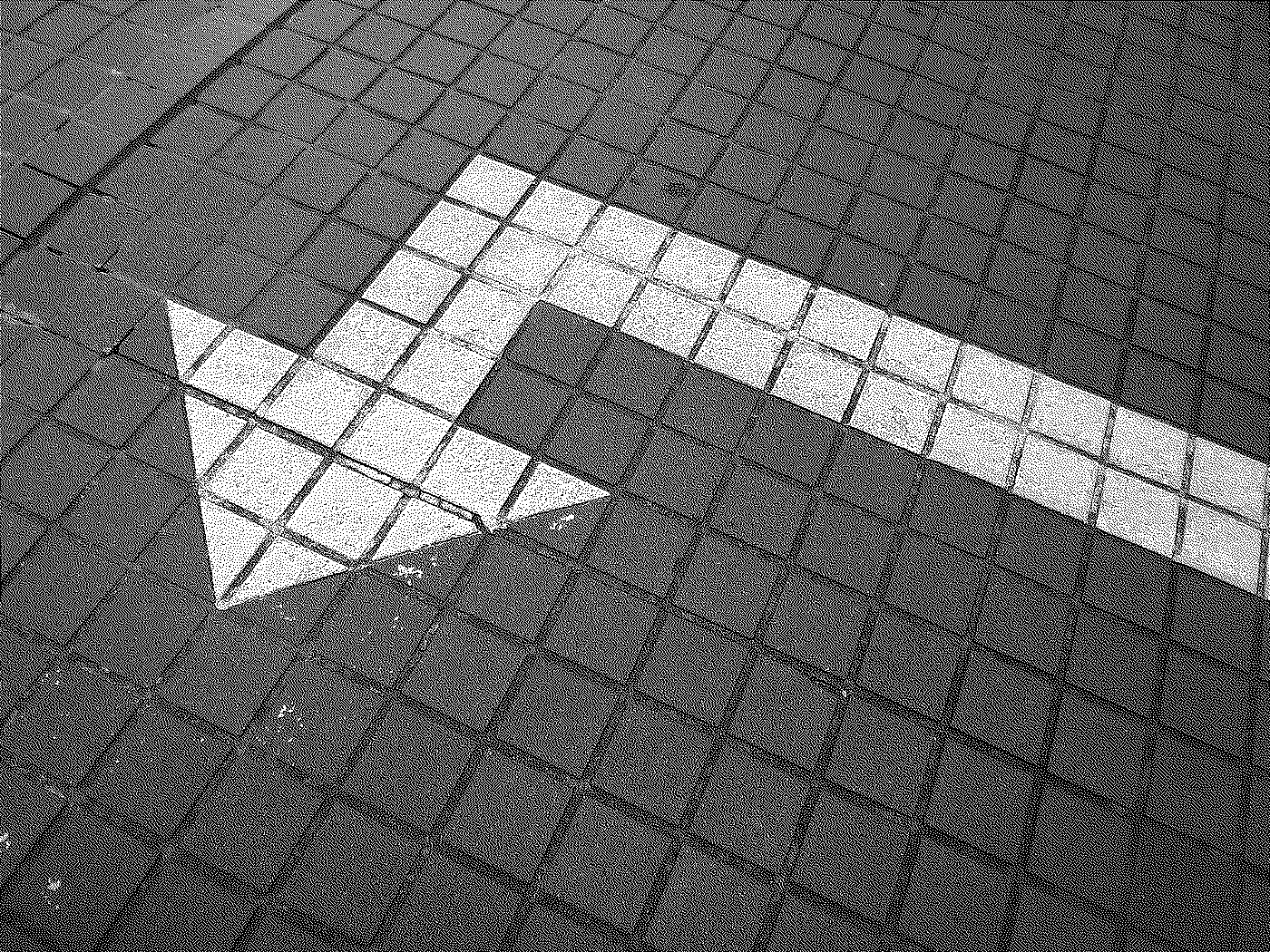 Close-up of a tiled floor with one white tile in the shape of a question mark.