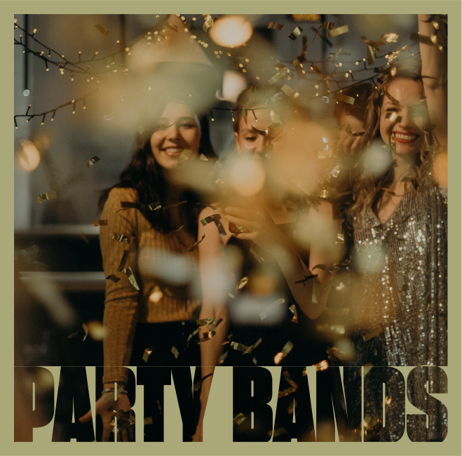 Three women smiling and celebrating with confetti and string lights in the background.