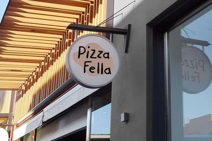 Illustrated logo and typography outside a store front. Part of a branding illustration system for pizzeria restaurant by Leeds artist Vicky Hughes. 